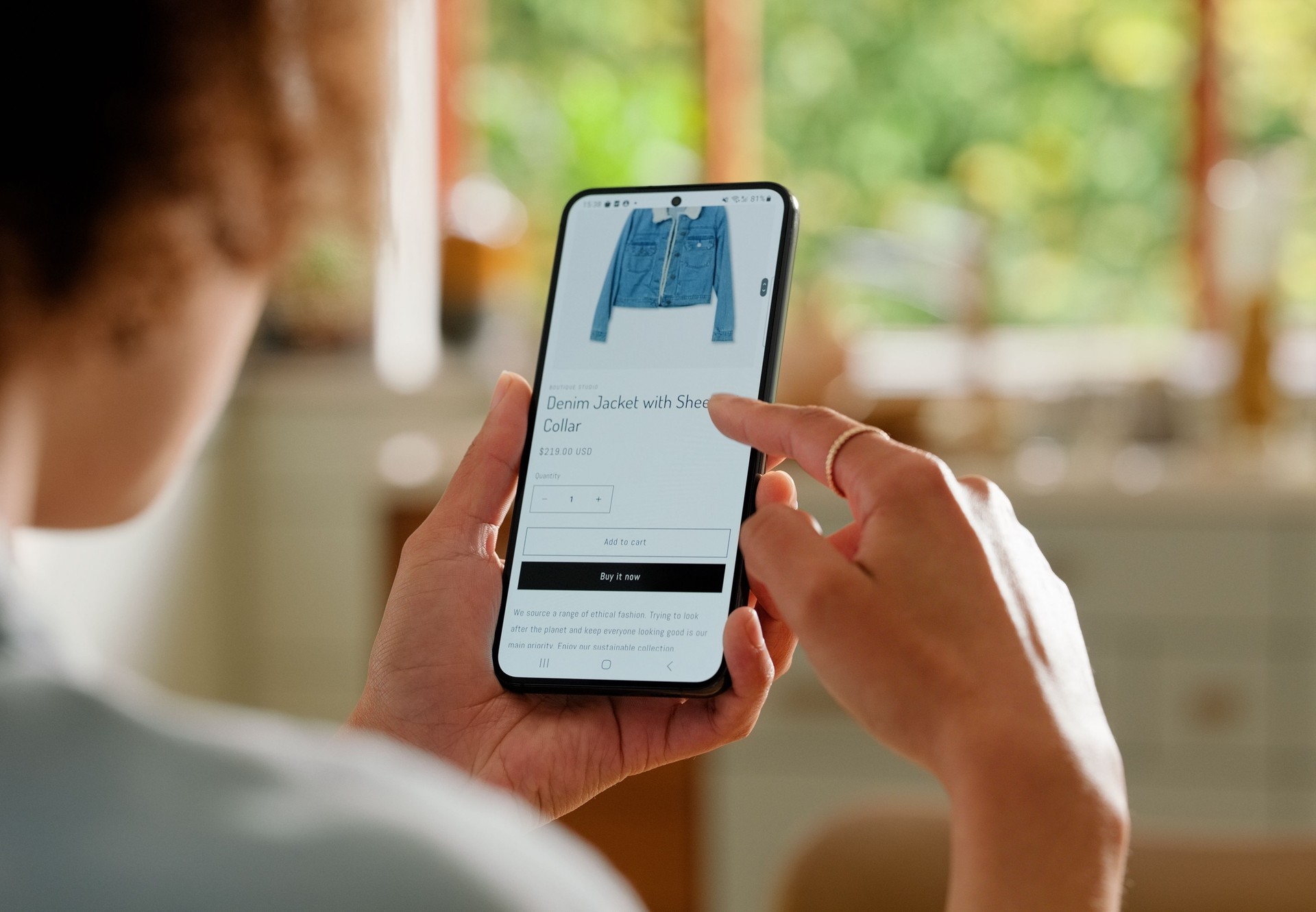 Online shopping, home and person with phone, clothes and e commerce, digital and browsing for sale. Choice, decision and fashion for customer, back view and app in mobile, technology and internet